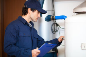 technician repairing an hot-water heater